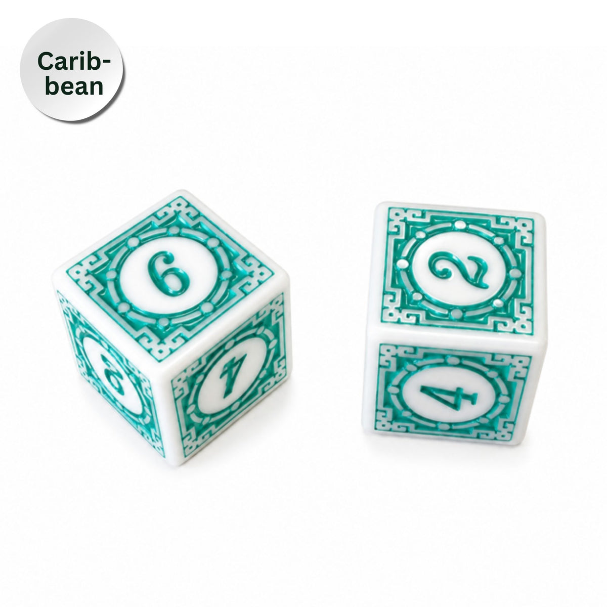 Two white cube dice with teal decorative borders and teal numbers 2, 4, 6, and 7, shown on a white background with a circular label reading 'Caribbean'.