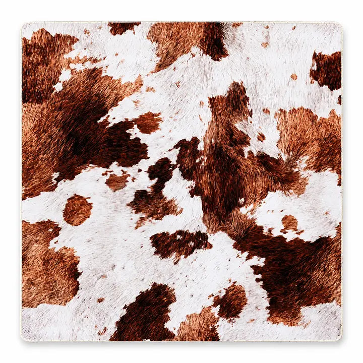 This is our Highland Cow Hide Safari Club Collection Mahjong Mat. This boutique-quality mat combines a bold floral and leopard print with the comfort and durability serious players appreciate.

Crafted from premium 3mm padded neoprene, it provides a smooth surface for effortless tile movement while helping reduce noise and protect your tabletop. Finished with fully stitched edges, it's made to last through years of Mahjong.