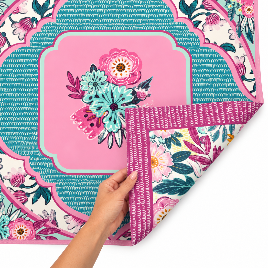 Lovely Lavender Double-Sided Leatherette Mahjong Mat. This eye-catching design combines beautiful shades of lavender, pink, turquoise, and soft mint with bold botanical florals and intricate decorative details. One side showcases a vibrant floral arrangement at the center, surrounded by a striking turquoise scalloped frame and coordinating floral accents. The playful mix of colors and patterns creates a distinctive look that brings personality and charm to your Mahjong tablescape.