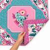 Lovely Lavender Double-Sided Leatherette Mahjong Mat. This eye-catching design combines beautiful shades of lavender, pink, turquoise, and soft mint with bold botanical florals and intricate decorative details. One side showcases a vibrant floral arrangement at the center, surrounded by a striking turquoise scalloped frame and coordinating floral accents. The playful mix of colors and patterns creates a distinctive look that brings personality and charm to your Mahjong tablescape.