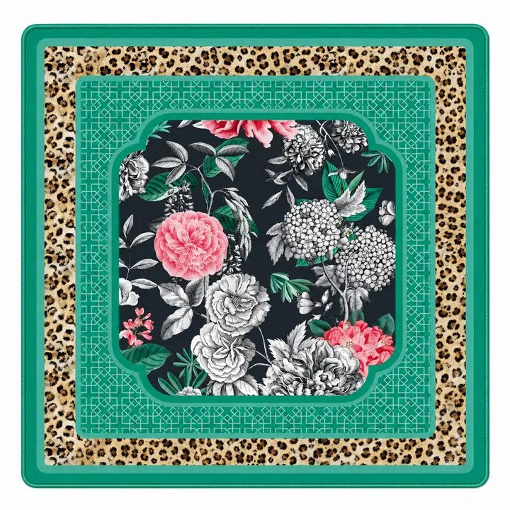 This is our Emerald Leopard in Bloom Premium Padded Mahjong Mat. This boutique-quality mat combines a bold floral and leopard print with the comfort and durability serious players appreciate.

Crafted from premium 3mm padded neoprene, it provides a smooth surface for effortless tile movement while helping reduce noise and protect your tabletop. Finished with fully stitched edges, it's made to last through years of Mahjong nights.