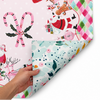 Our Holly Jolly Double-Sided Leatherette Mahjong Mat. One side features a colorful Christmas scene filled with nostalgic holiday favorites. From Santa and his sleigh to candy canes, ornaments, gingerbread, and gifts.