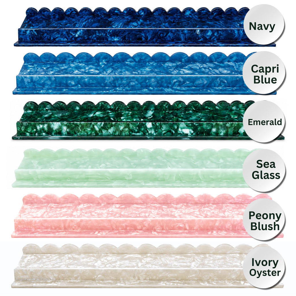 Six scalloped Mahjong racks shown in different colors on a white background, each labeled with a color name: Navy, Capri Blue, Emerald, Sea Glass, Peony Blush, and Ivory Oyster.