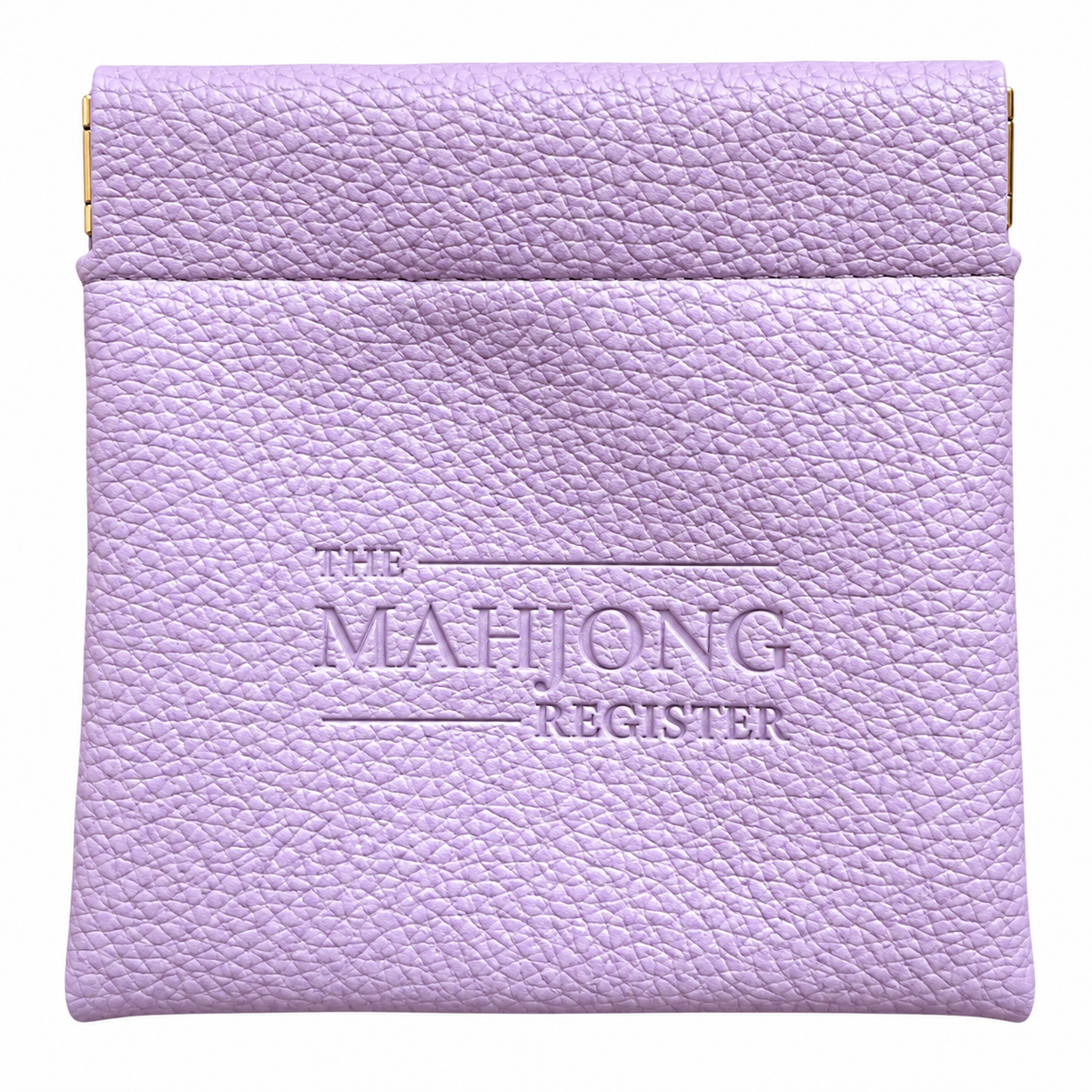 A lavender purple textured leather mahjong register with gold-tone metal clasps on the sides and 'THE MAHJONG REGISTER' embossed on the front, shown against a plain white background.